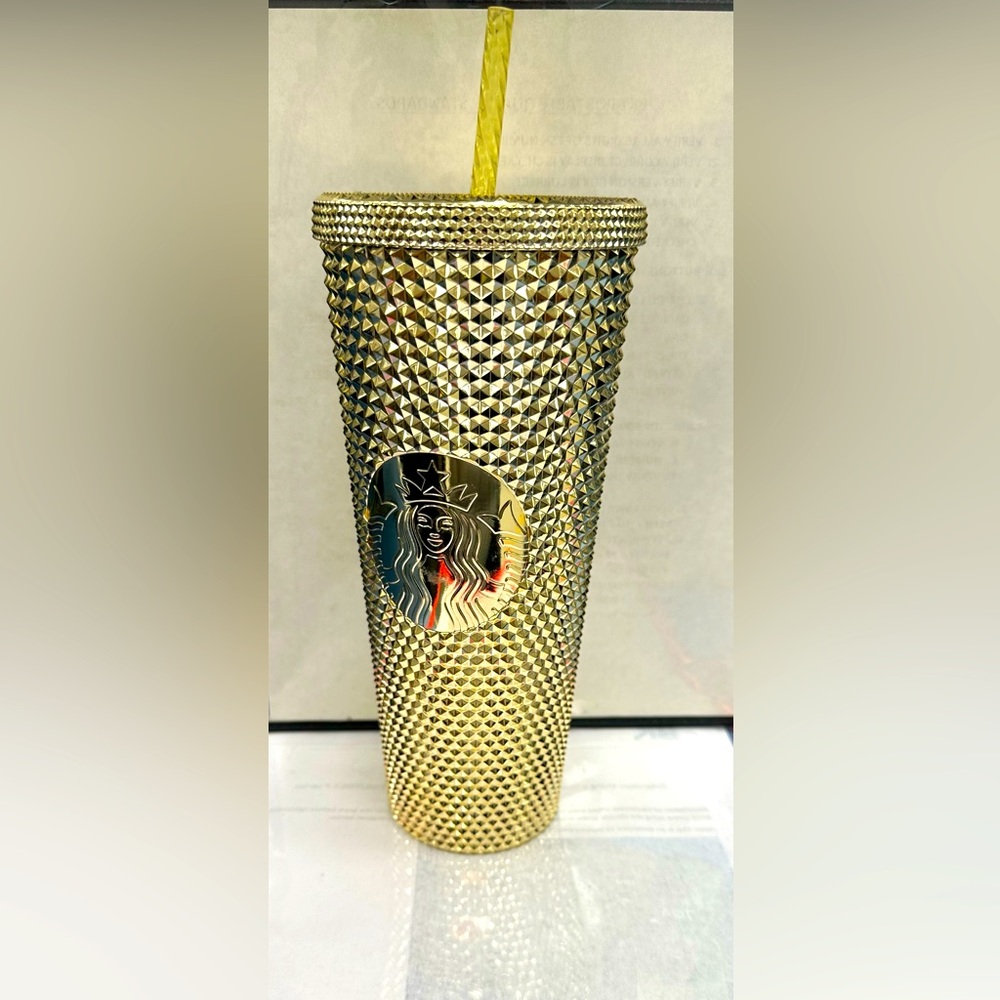 Starbucks gold cup with straw